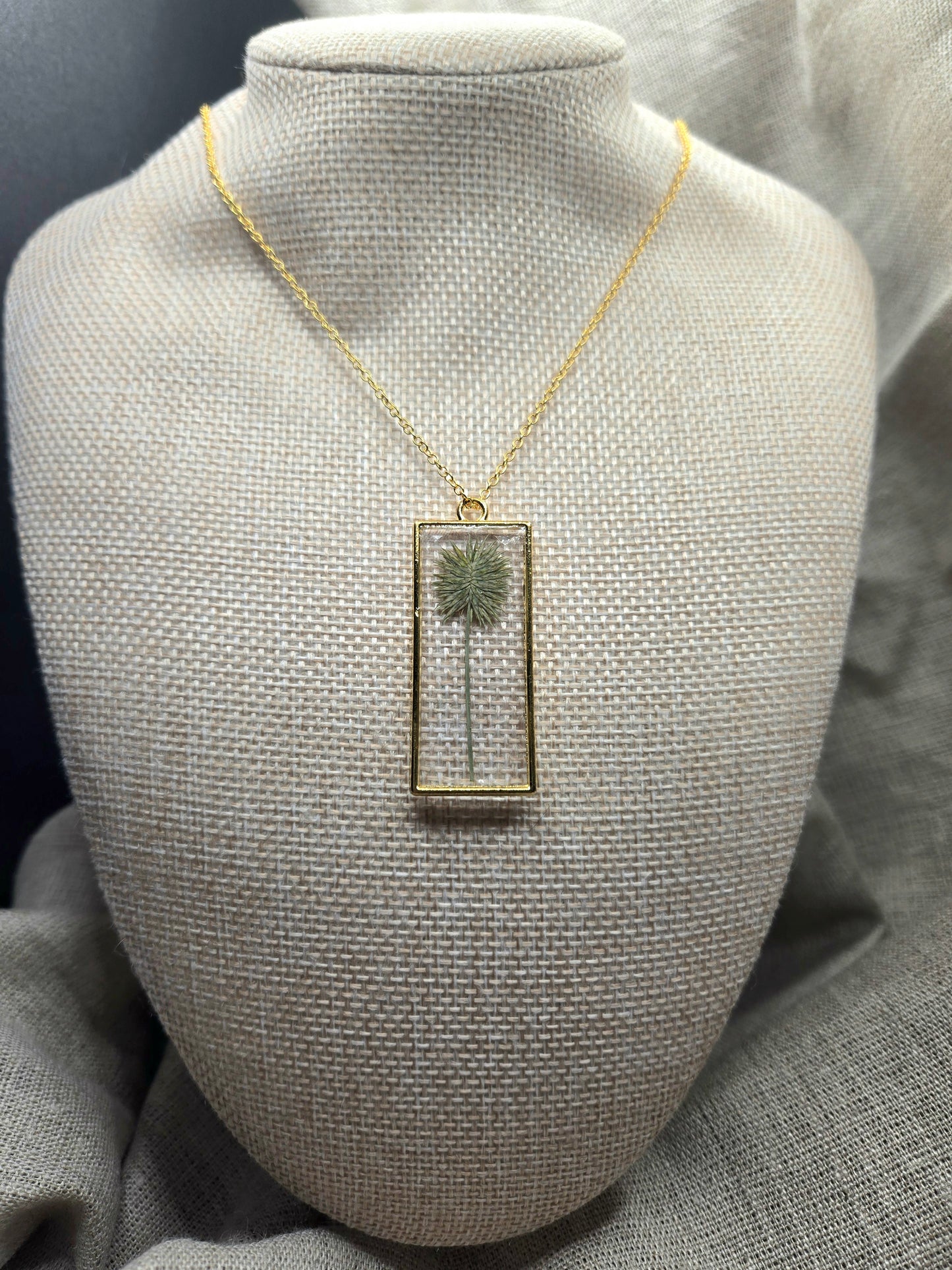 Green plant long rectangle pendant with chain.