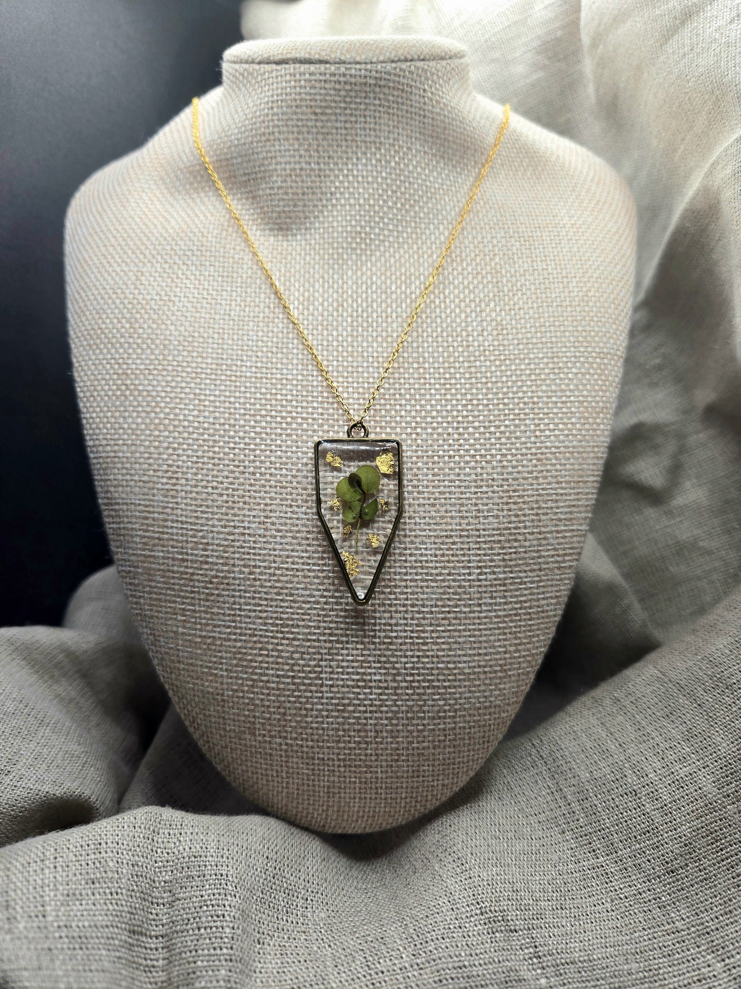 Eucalyptus and gold leaf pendant with chain.