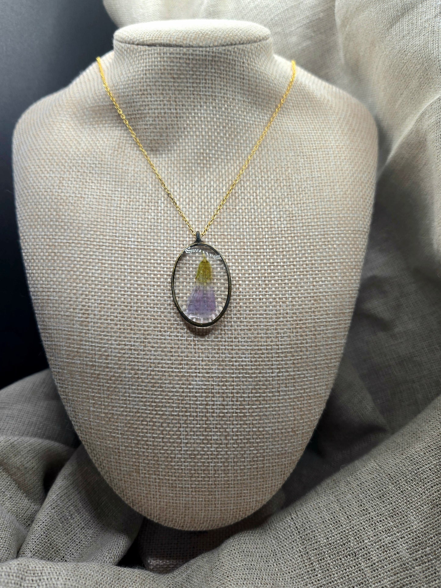 Oval pendant with chain.