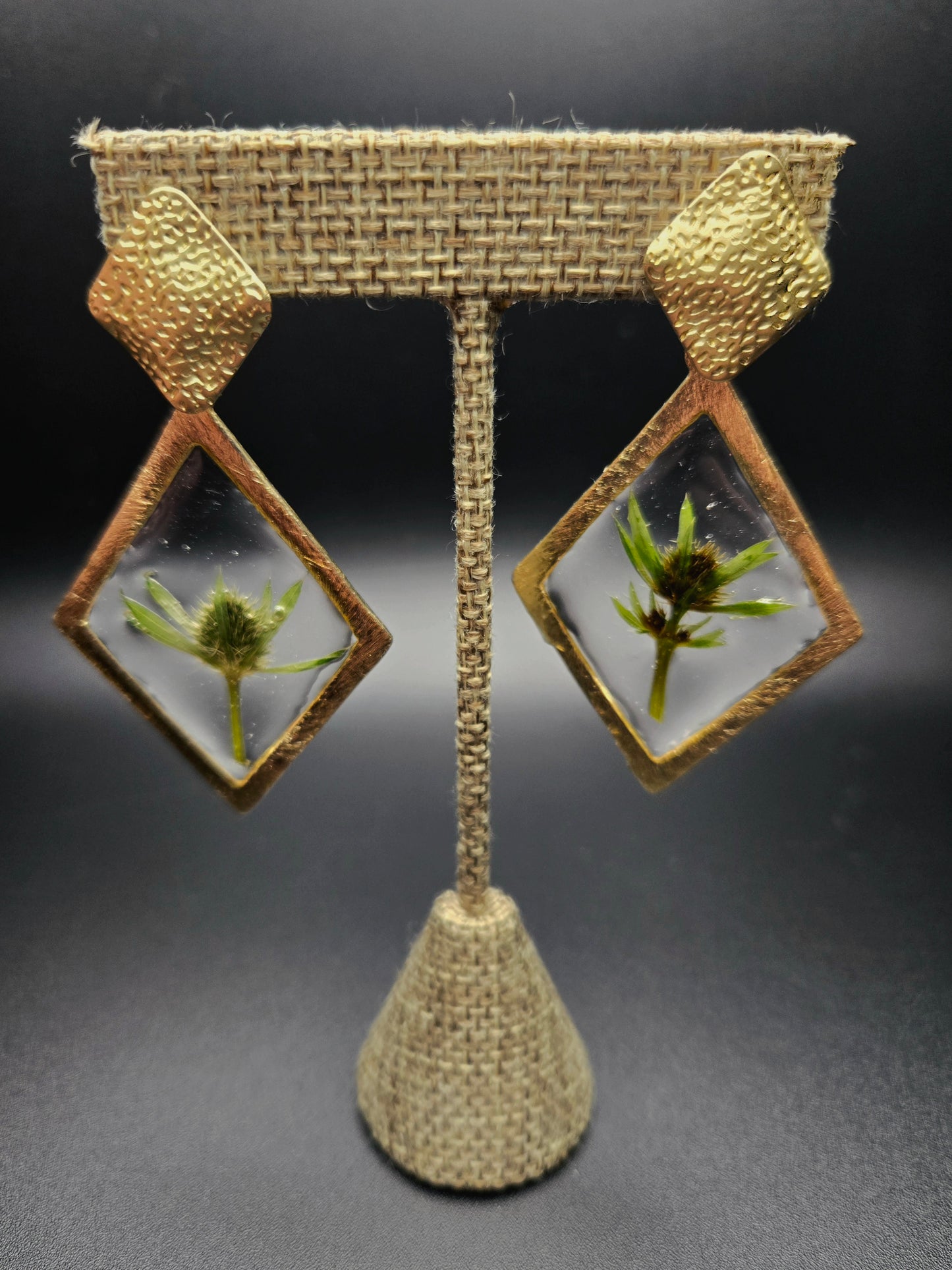 Diamond shaped dangle studs.