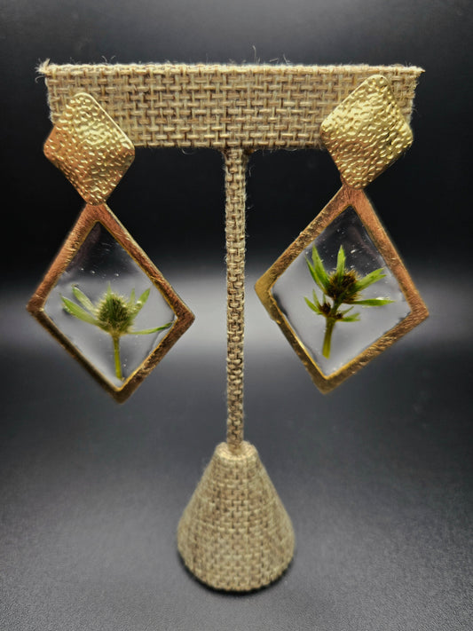 Diamond shaped dangle studs.