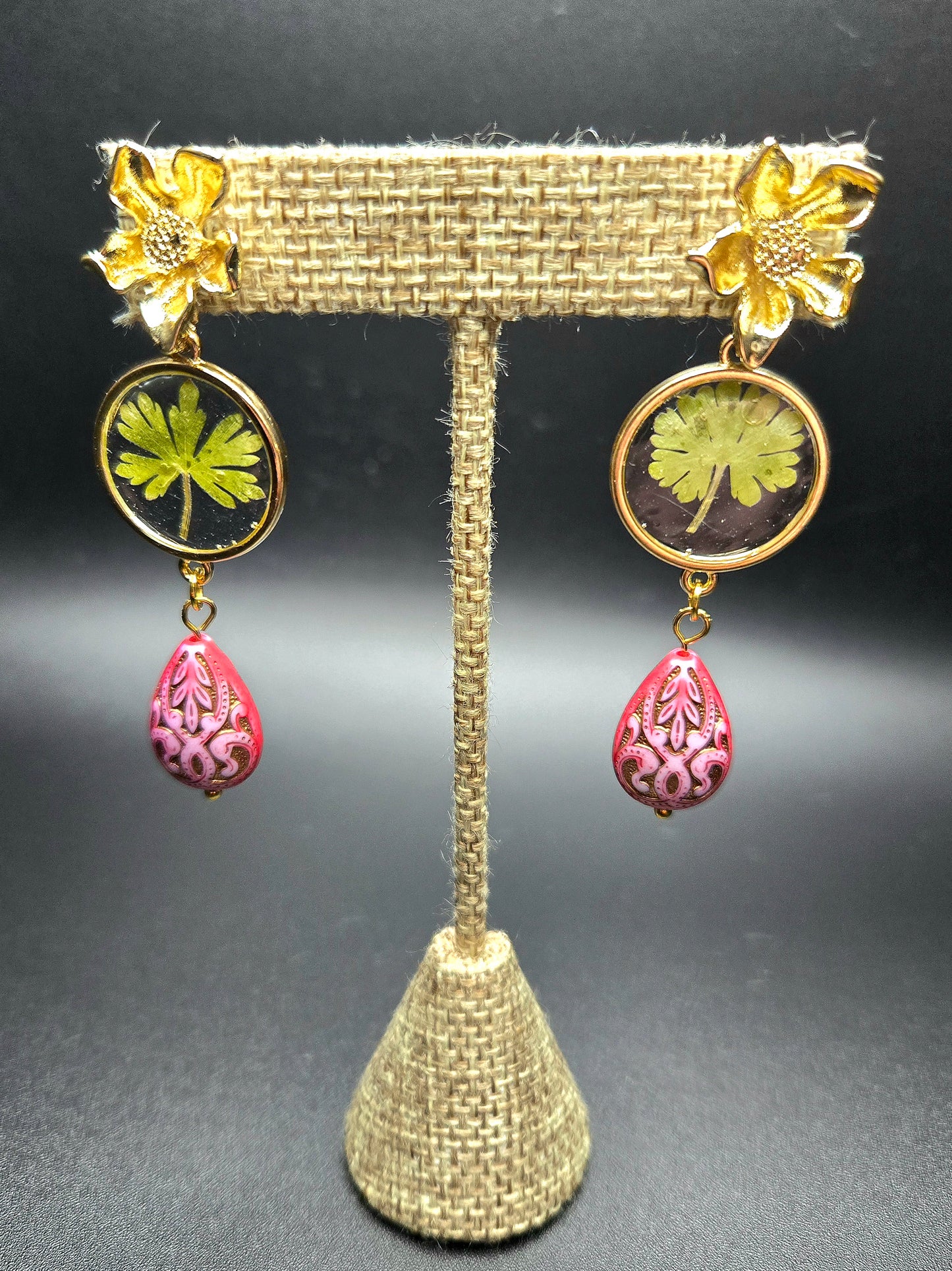 Stud earrings with pink bead detail