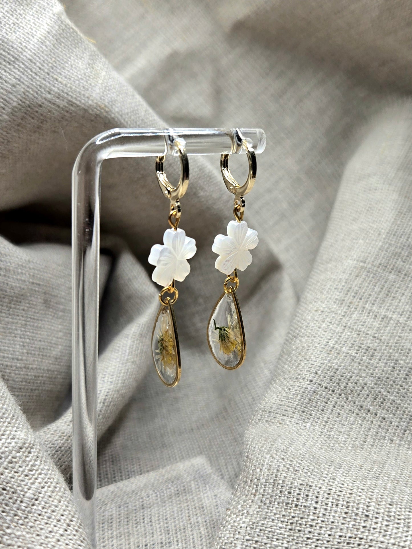 Dainty earrings with teardrop cast flower and pearl daisy.