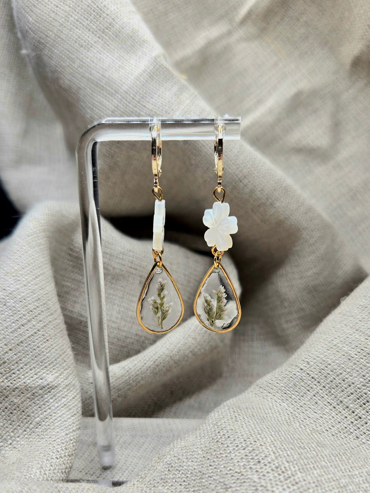 Dainty earrings with teardrop cast flower and pearl daisy.